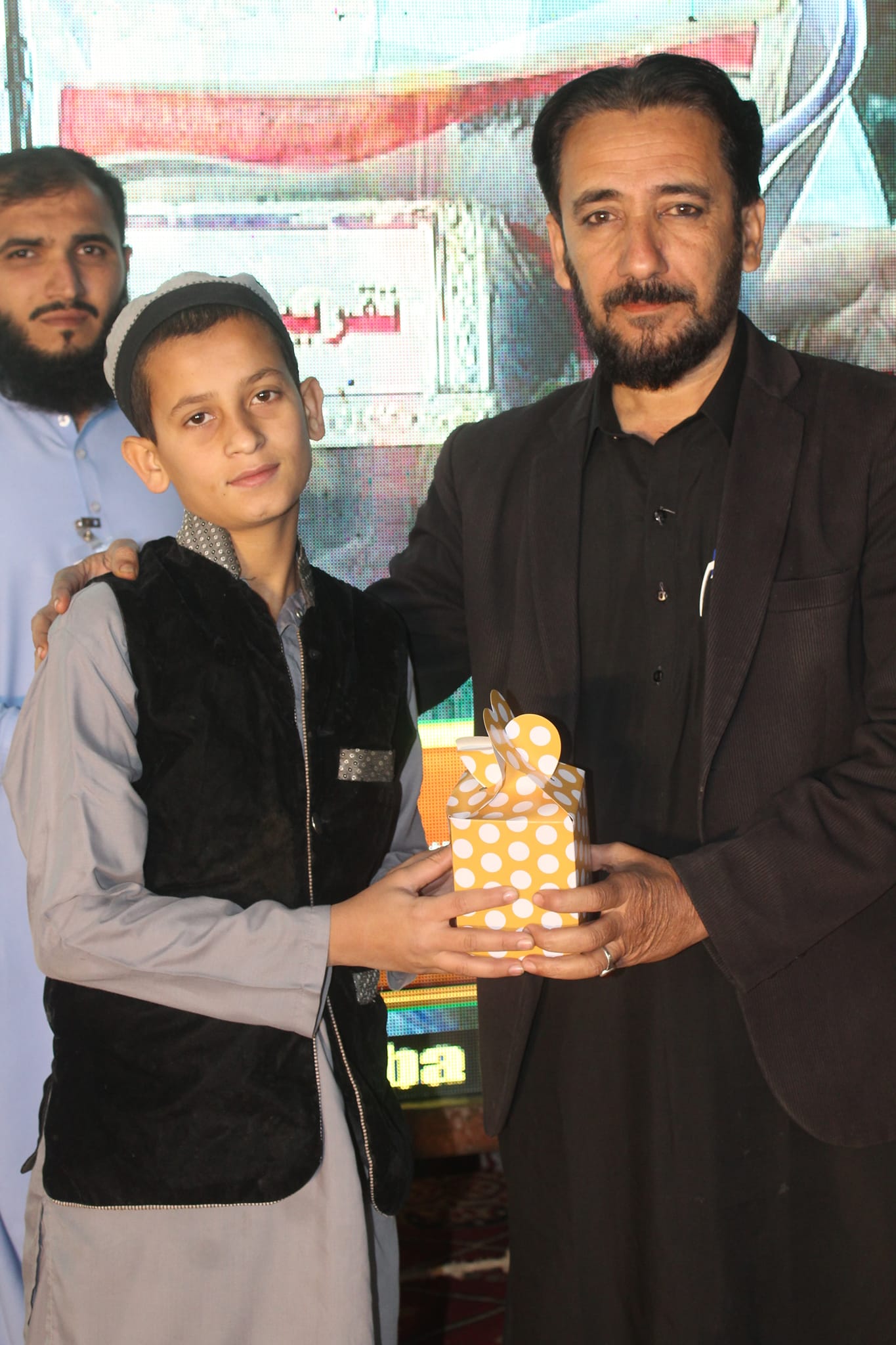 Dog sitting in a yellow kayak